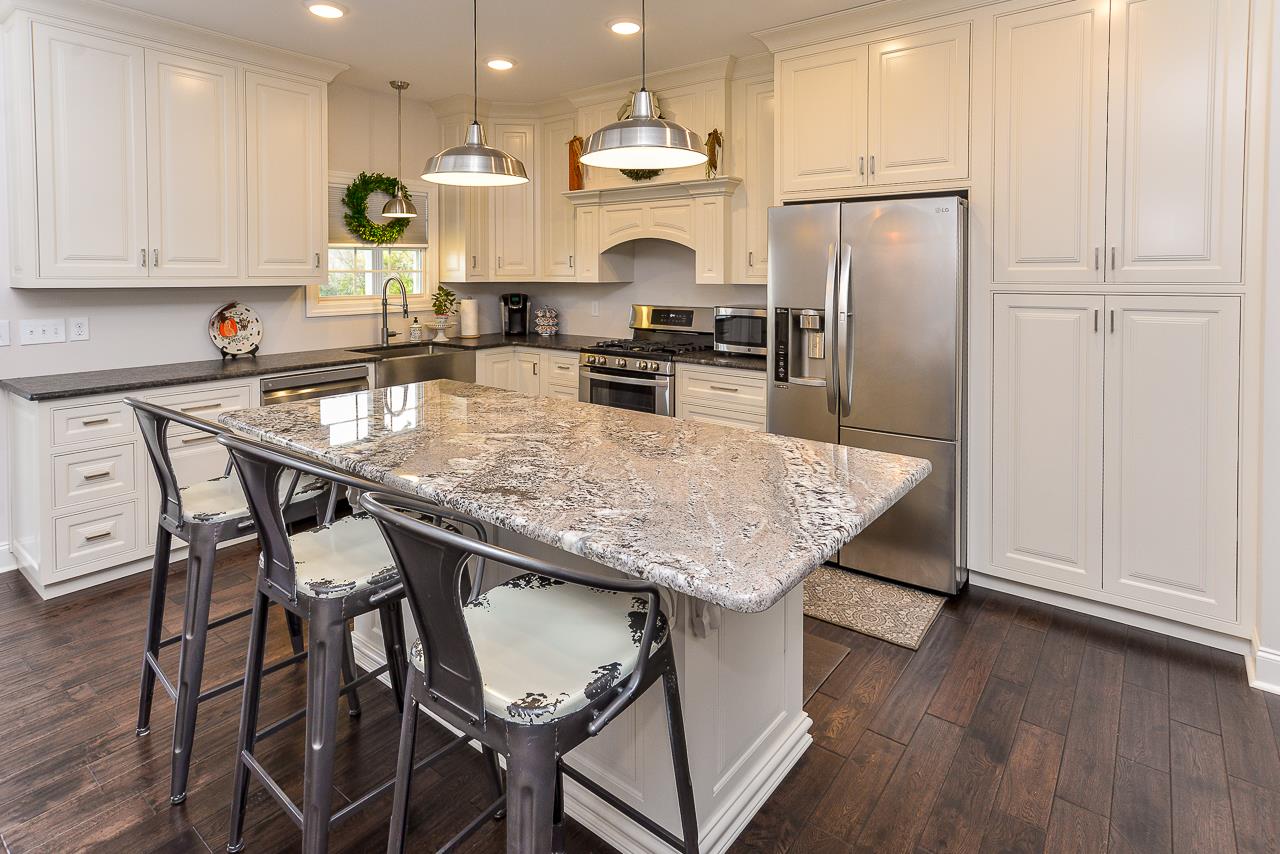 337 Patrick Road Fayetteville, TN 37334 - Photo 10 of 30 a kitchen with granite countertop kitchen island stainless steel appliances a refrigerator and a stove top oven