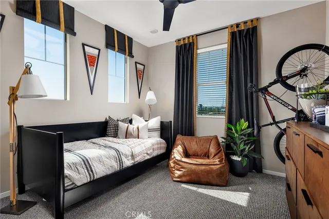 a bedroom with furniture and a window