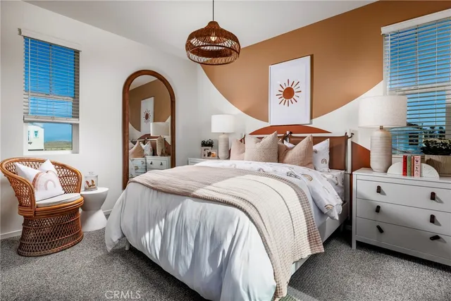 a bedroom with a bed and a couch