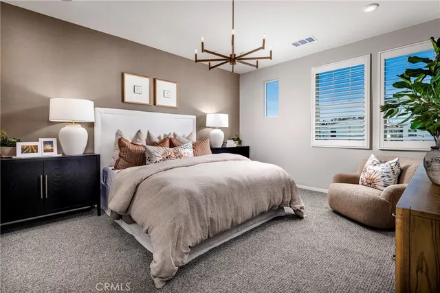 a spacious bedroom with a bed and furniture