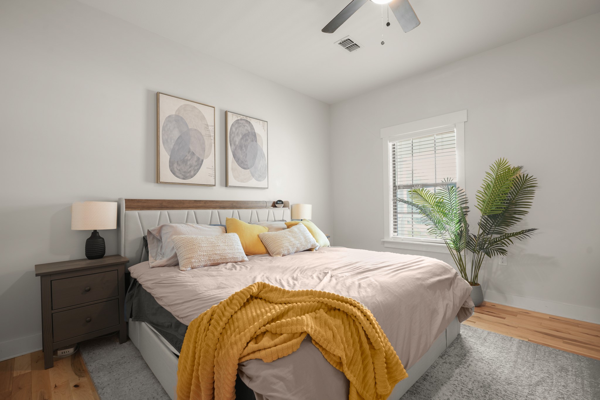 301 Old Thorndale Road Taylor, TX 76574 - Photo 11 of 29 Hardwood floors and bright window light define this peaceful sleeping sanctuary.