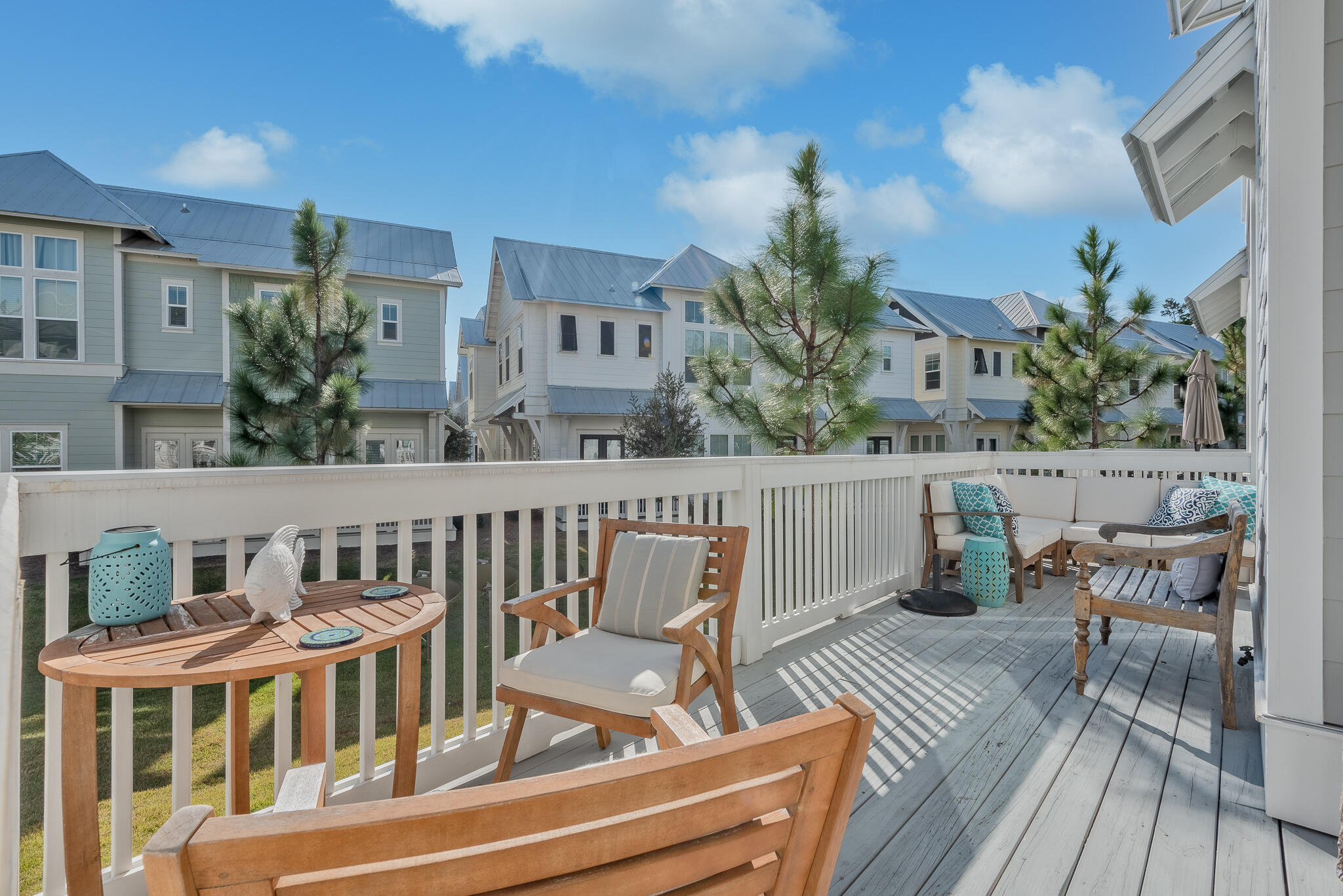 Undisclosed Address Inlet Beach, FL 32461 - Photo 11 of 25 a view of a chair and tables in the balcony