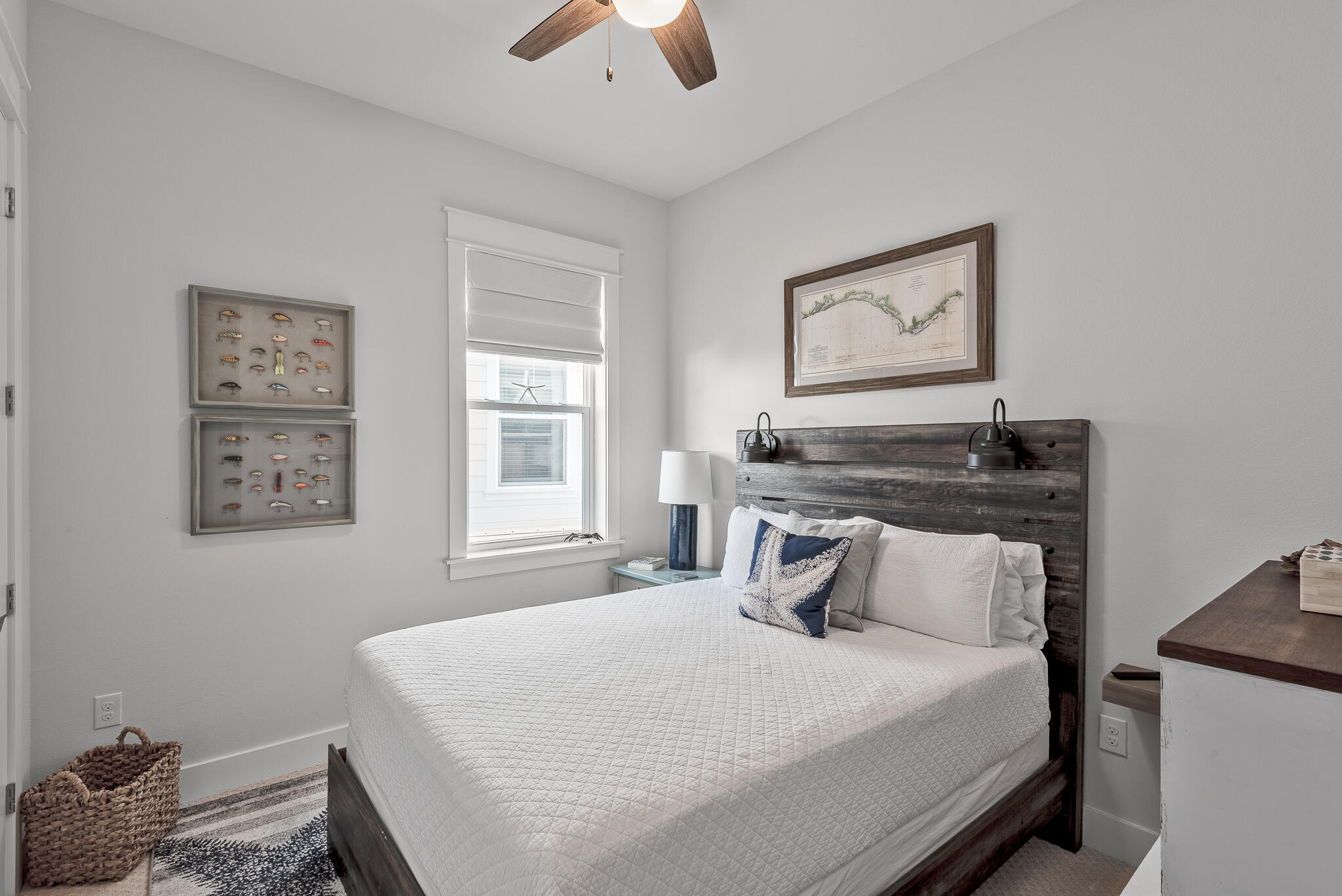 Undisclosed Address Inlet Beach, FL 32461 - Photo 15 of 25 a bedroom with a bed and a chandelier