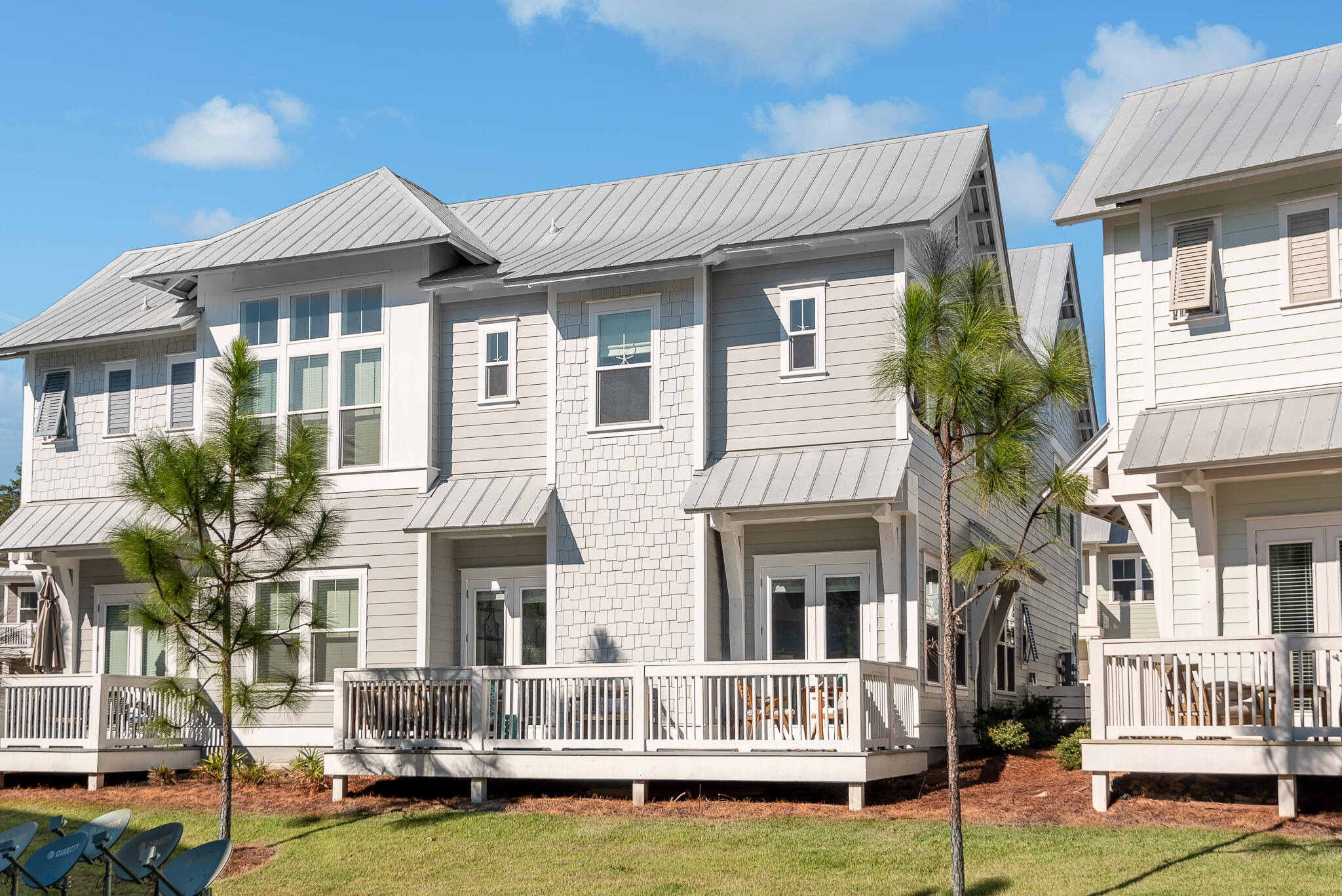 Undisclosed Address Inlet Beach, FL 32461 - Photo 2 of 25 a front view of a house with yard and porch