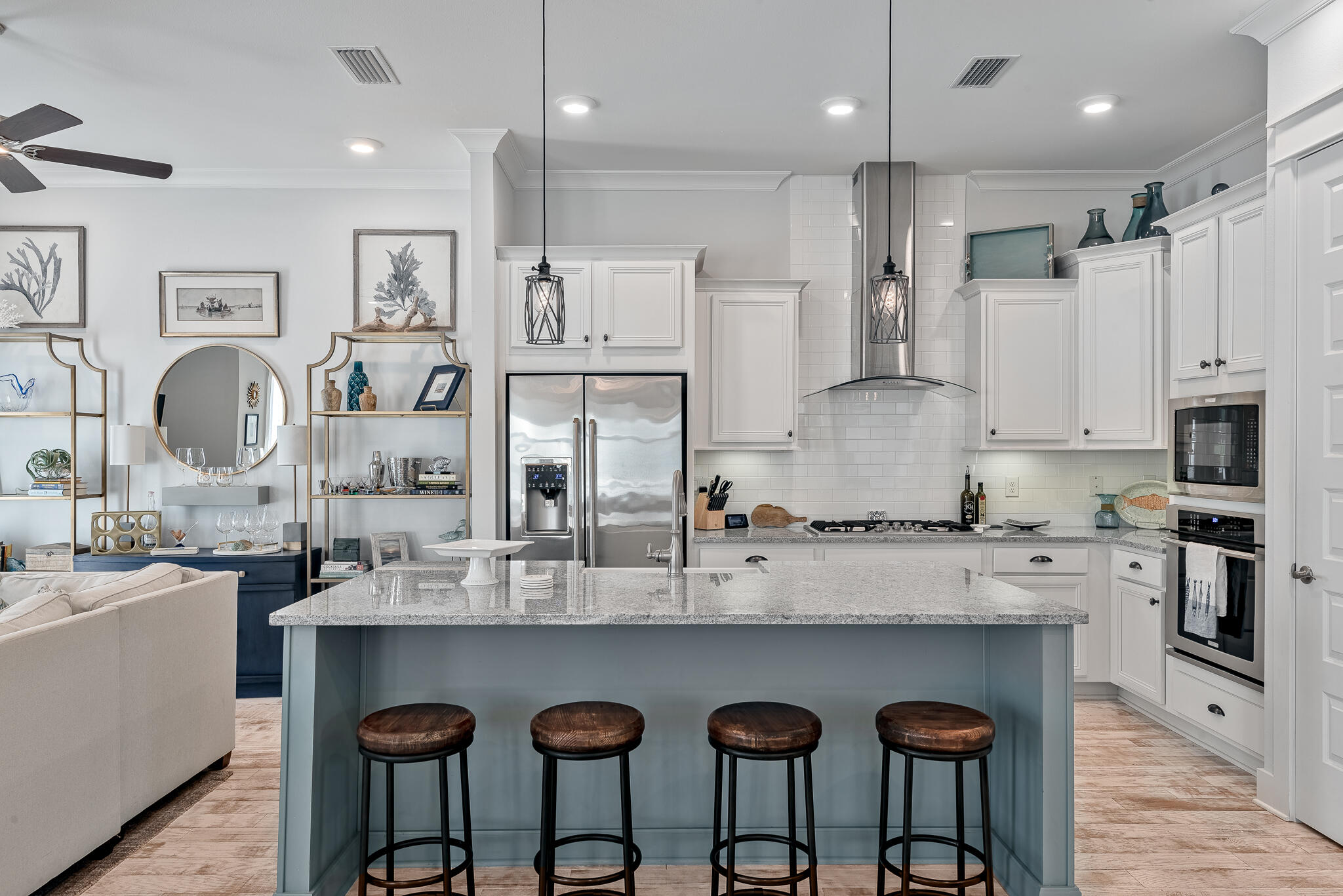 Undisclosed Address Inlet Beach, FL 32461 - Photo 5 of 25 a kitchen with stainless steel appliances granite countertop a table chairs sink and stove top oven