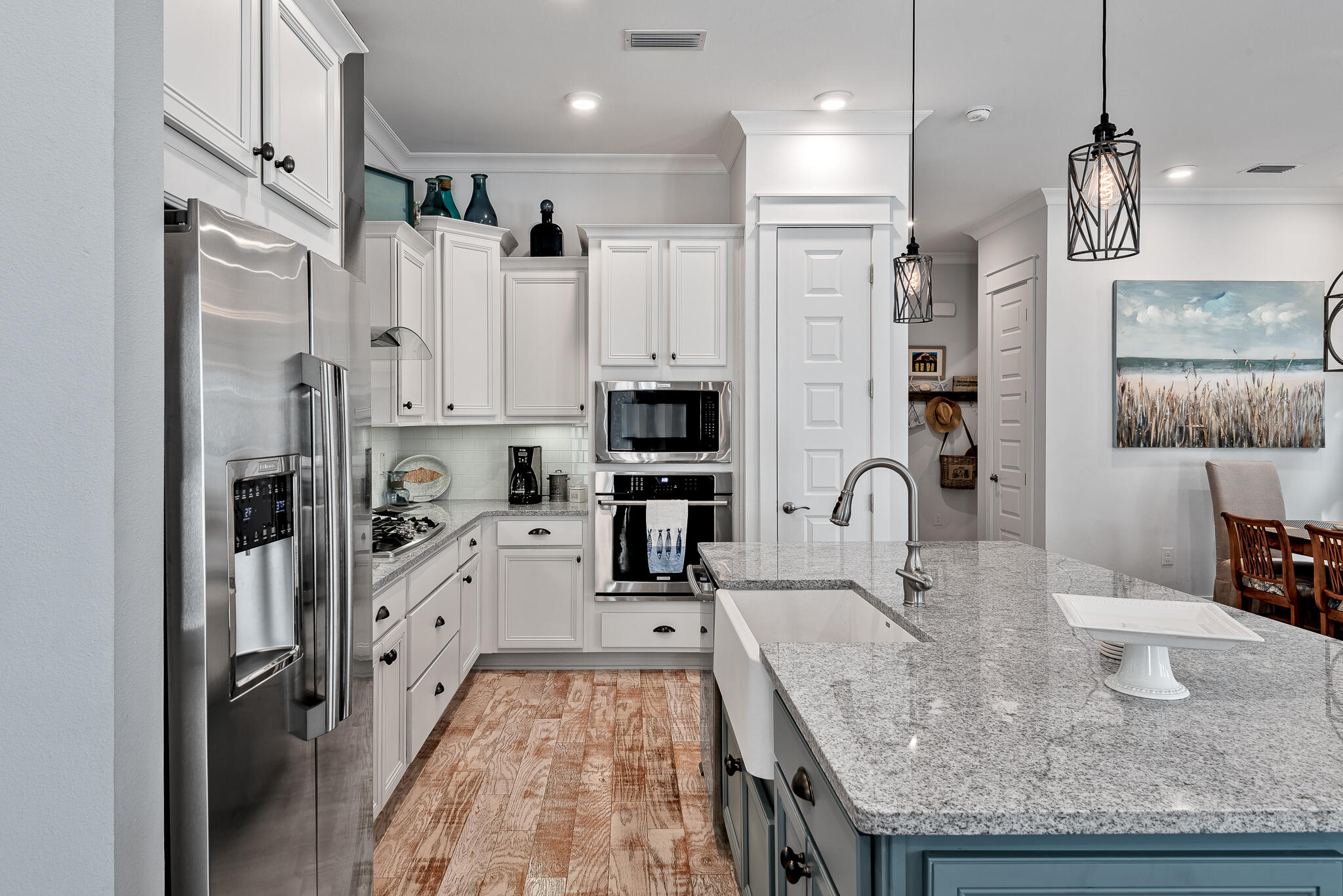 Undisclosed Address Inlet Beach, FL 32461 - Photo 6 of 25 a kitchen with stainless steel appliances granite countertop a sink refrigerator and cabinets