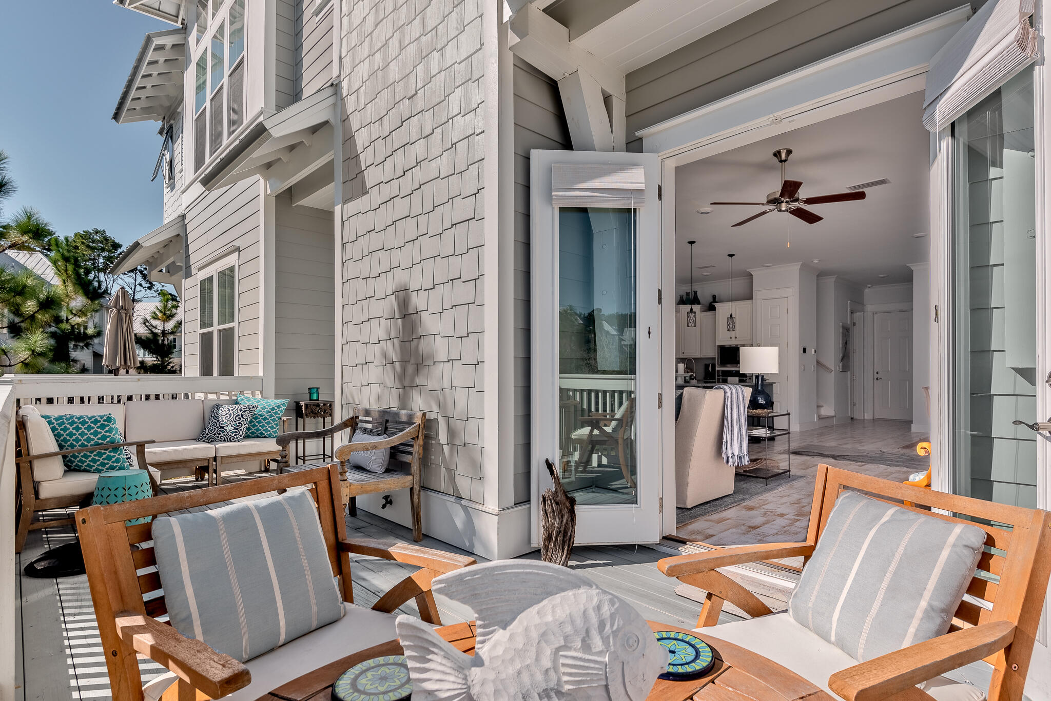 Undisclosed Address Inlet Beach, FL 32461 - Photo 10 of 25 a view of a patio with couches table and chairs and potted plants