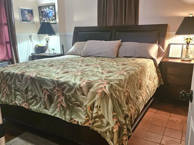 a bedroom with a bed and furniture