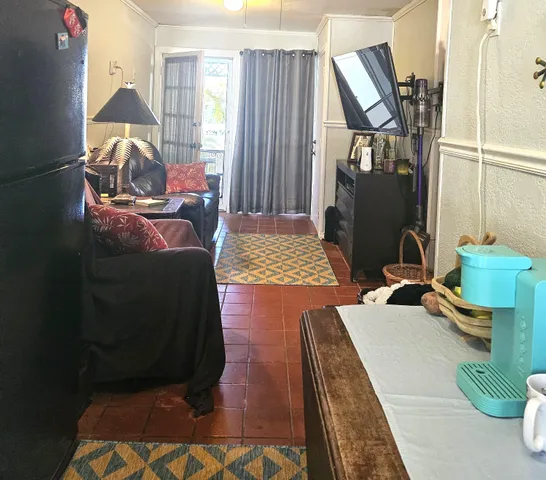 a bedroom with a bed and lamp