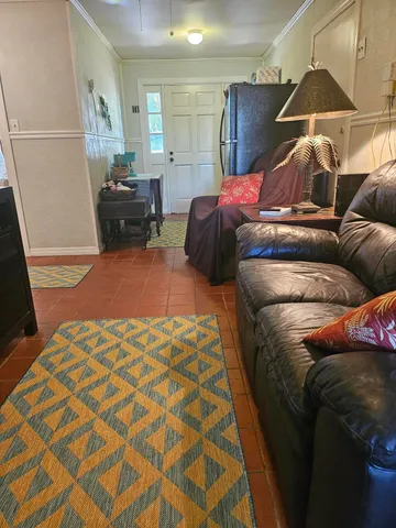 a large bed sitting in a bedroom and a mirror