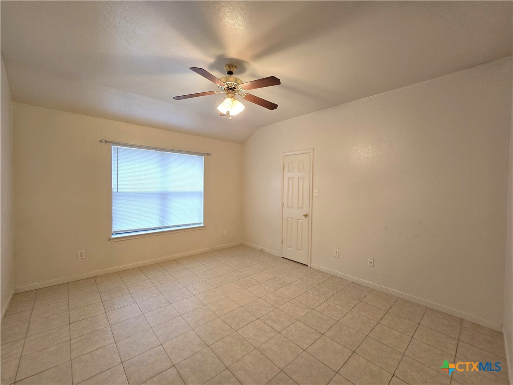 1411 Nicholas Circle, Unit B Killeen, TX 76542 - Photo 11 of 23 a view of an empty room with a window