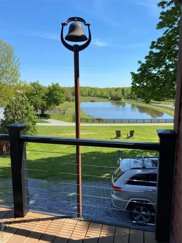 a view of a back yard with a wooden fence
