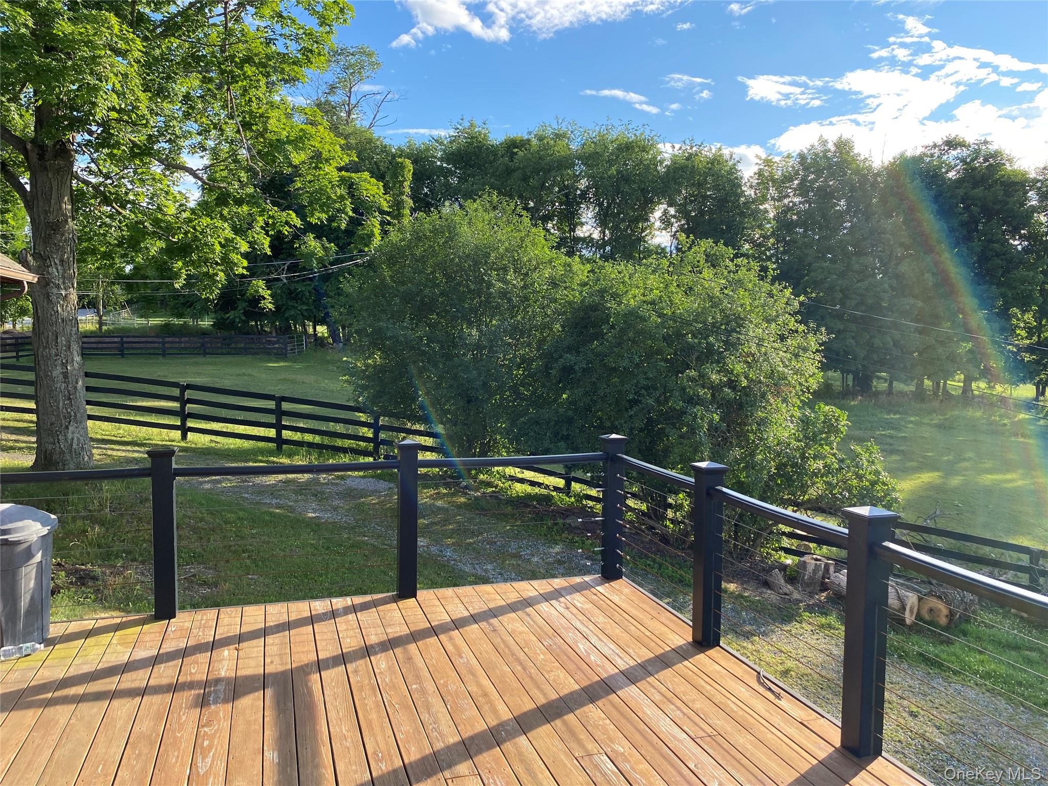 53 Day Road Campbell Hall, NY 10916 - Photo 15 of 31 a view of balcony with two chairs and wooden floor