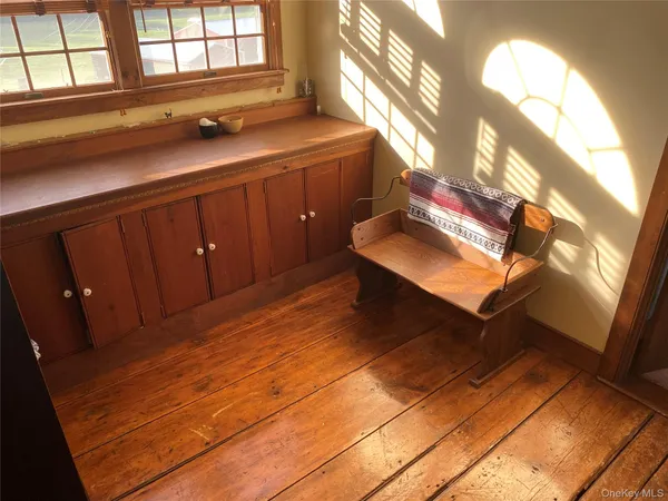 a room with window and furniture