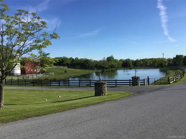 a view of a lake with a big yard