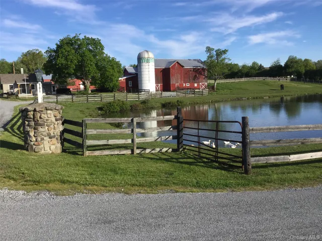 a view of a lake with a bench in front of it