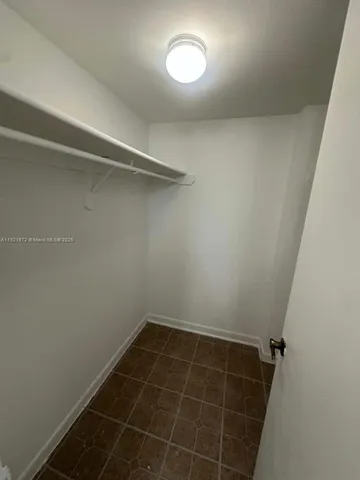 a view of a room with rack on the wall