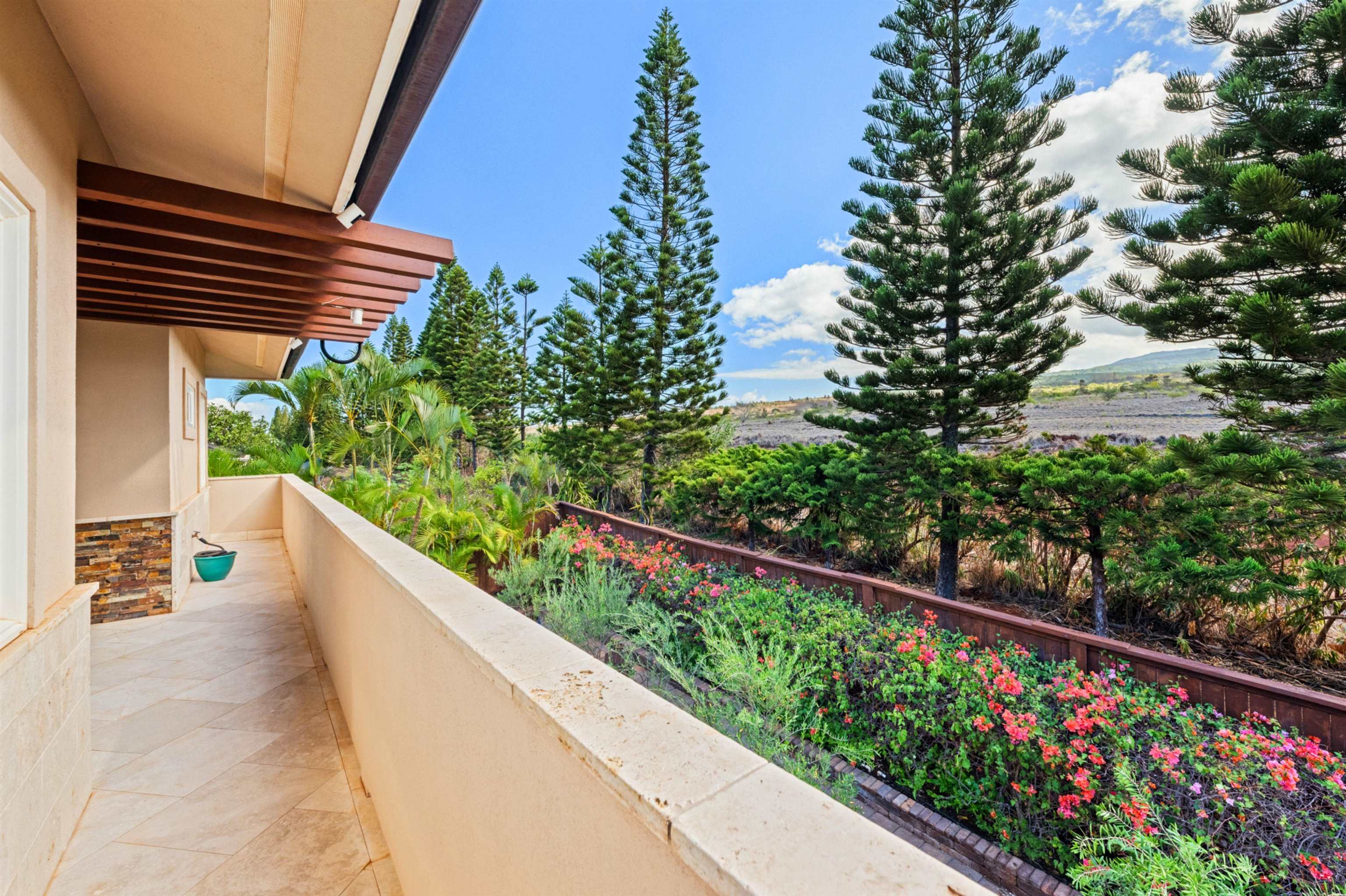 17 Kahana Ridge Place Lahaina, HI 96761 - Photo 29 of 50 a view of balcony with wooden floor and flowers