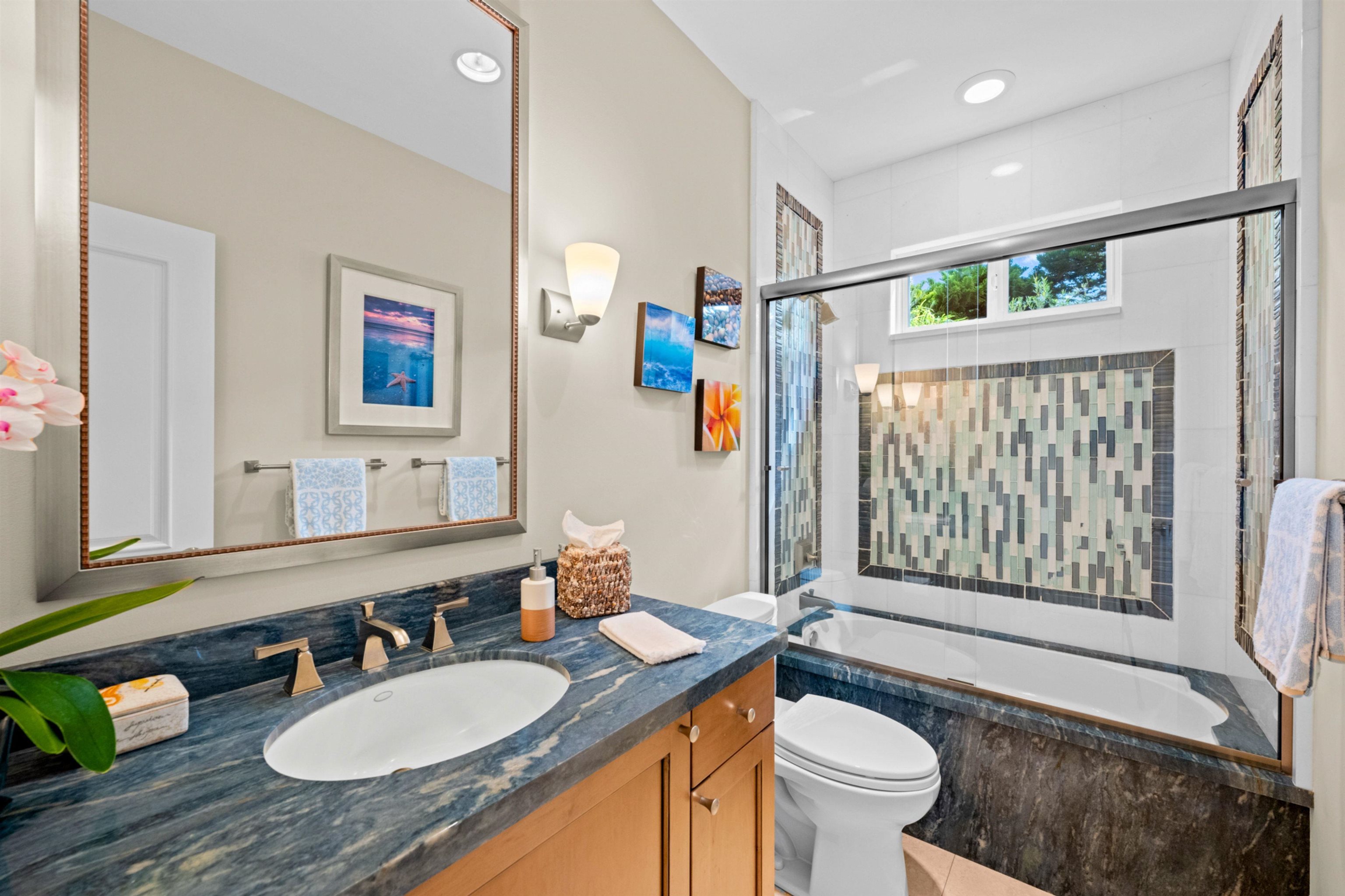 17 Kahana Ridge Place Lahaina, HI 96761 - Photo 36 of 50 a bathroom with a granite countertop toilet a sink and a mirror