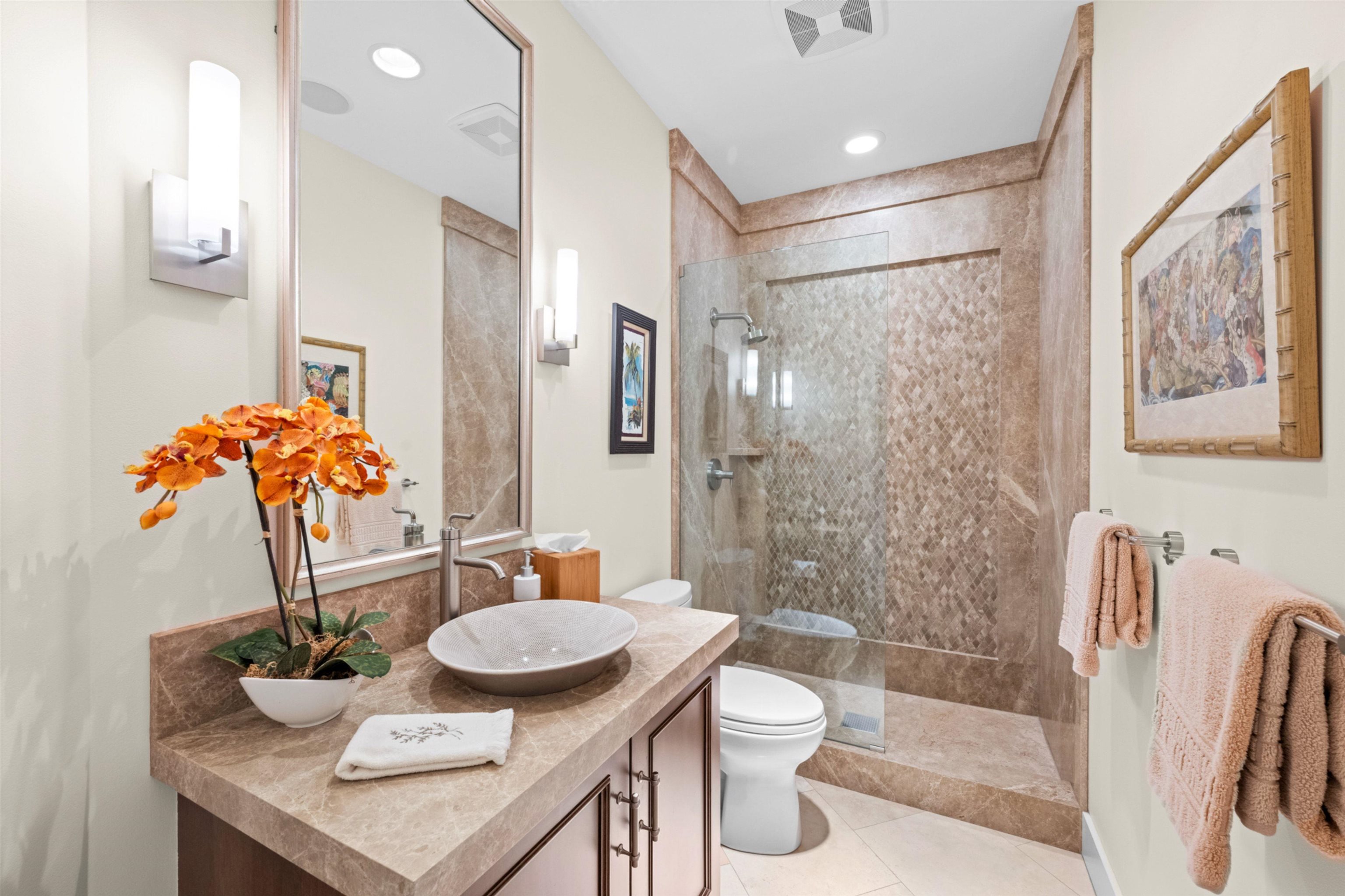 17 Kahana Ridge Place Lahaina, HI 96761 - Photo 42 of 50 a bathroom with a granite countertop sink toilet and shower