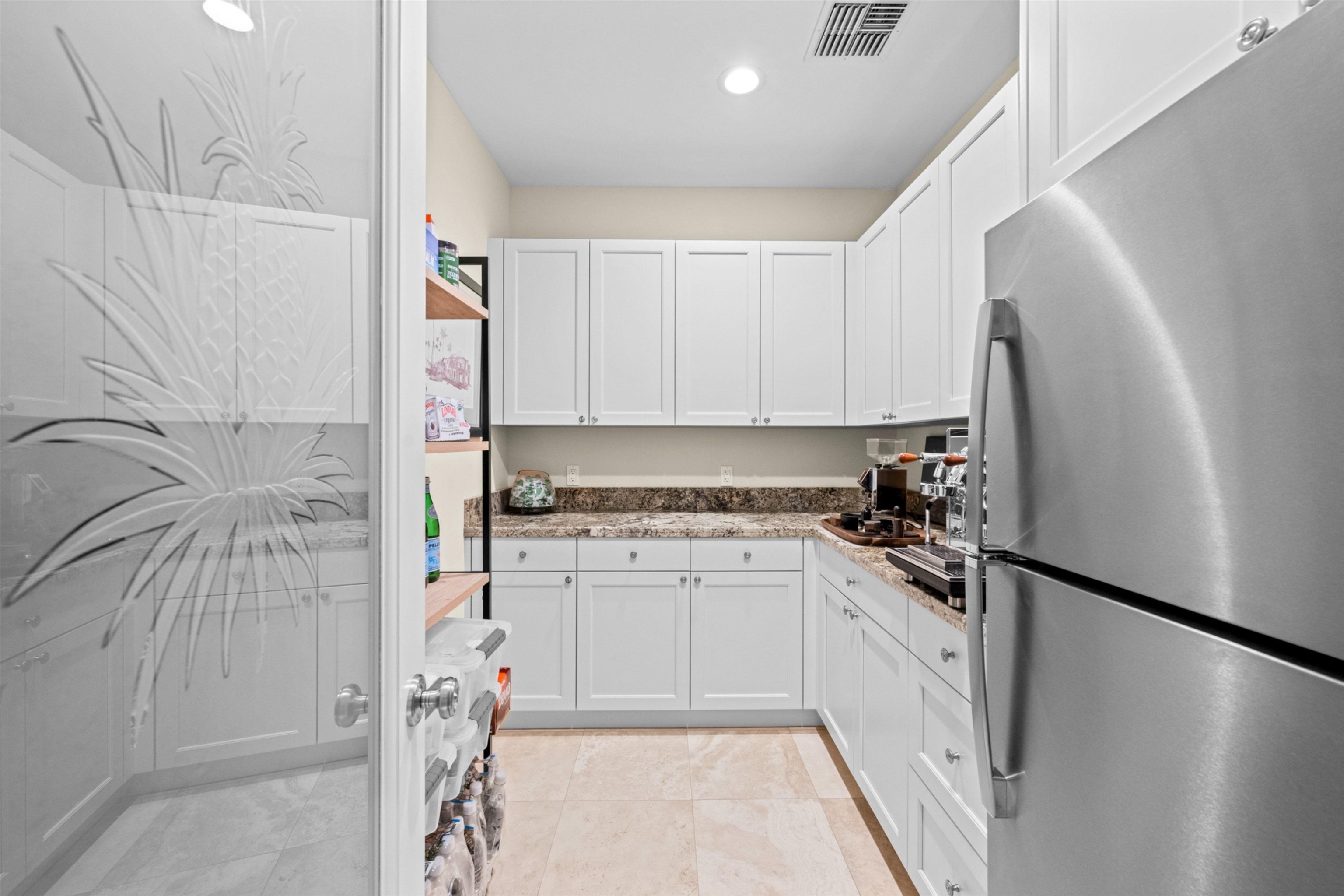 17 Kahana Ridge Place Lahaina, HI 96761 - Photo 44 of 50 a kitchen with stainless steel appliances a refrigerator sink and cabinets
