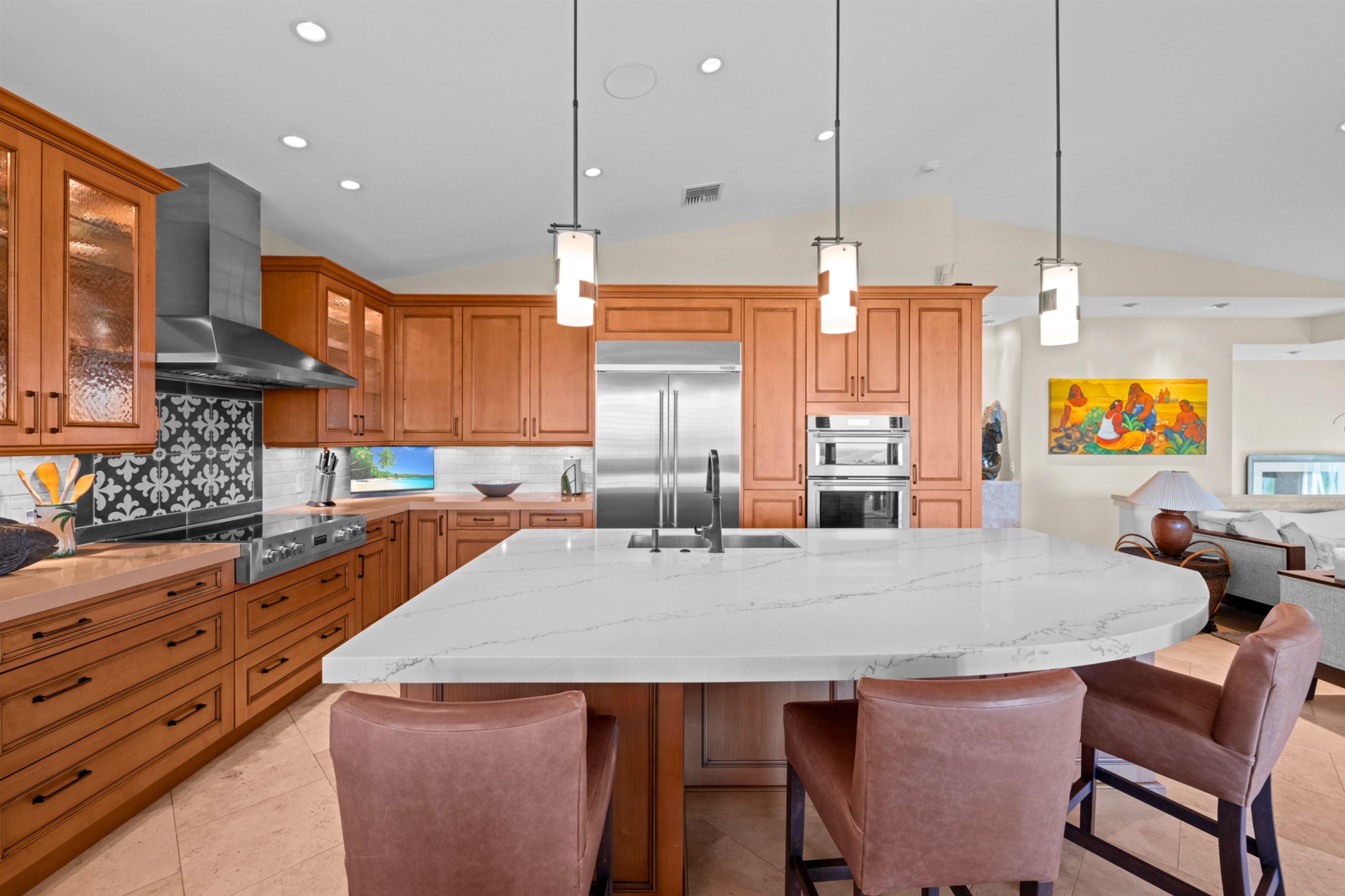 17 Kahana Ridge Place Lahaina, HI 96761 - Photo 5 of 50 a kitchen with stainless steel appliances granite countertop a stove a sink a microwave a center island and chairs