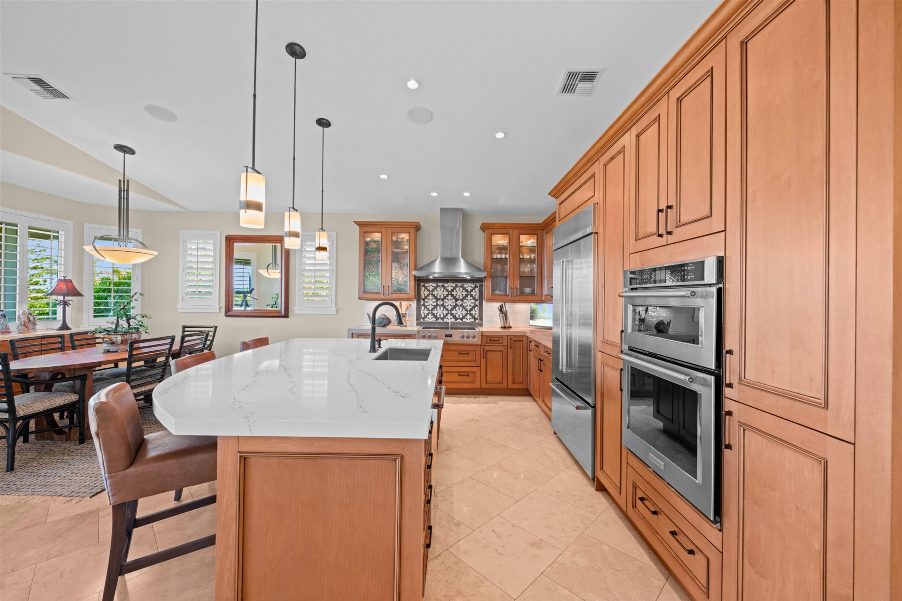 17 Kahana Ridge Place Lahaina, HI 96761 - Photo 7 of 50 a large kitchen with stainless steel appliances granite countertop a sink a stove and a refrigerator