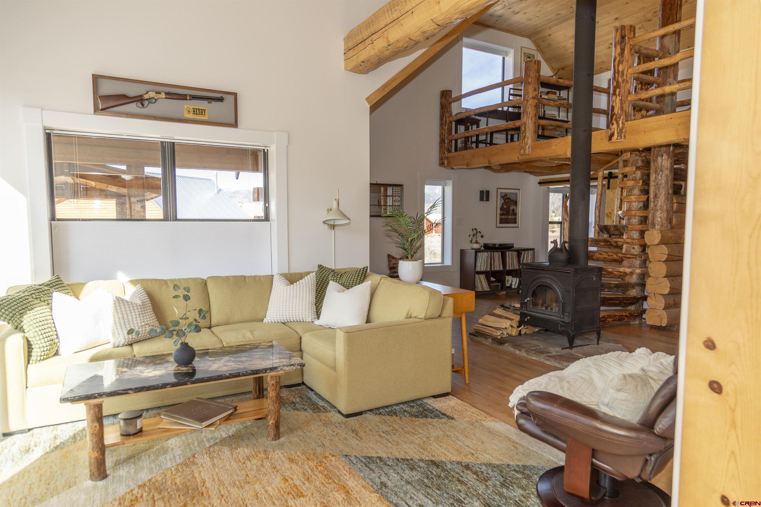 148 Rio Grande Drive Creede, CO 81130 - Photo 11 of 38 a living room with furniture and a rug