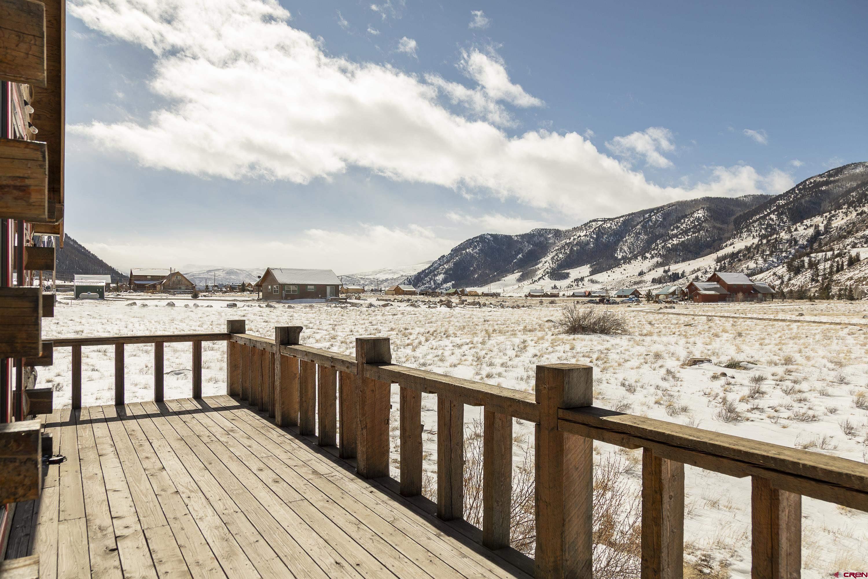 148 Rio Grande Drive Creede, CO 81130 - Photo 31 of 38 a view of a balcony with wooden floor and city view