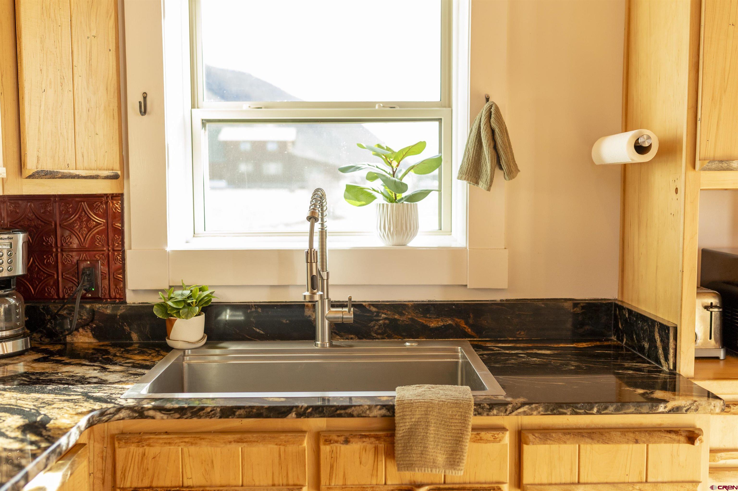 148 Rio Grande Drive Creede, CO 81130 - Photo 6 of 38 a kitchen with a window and a counter top