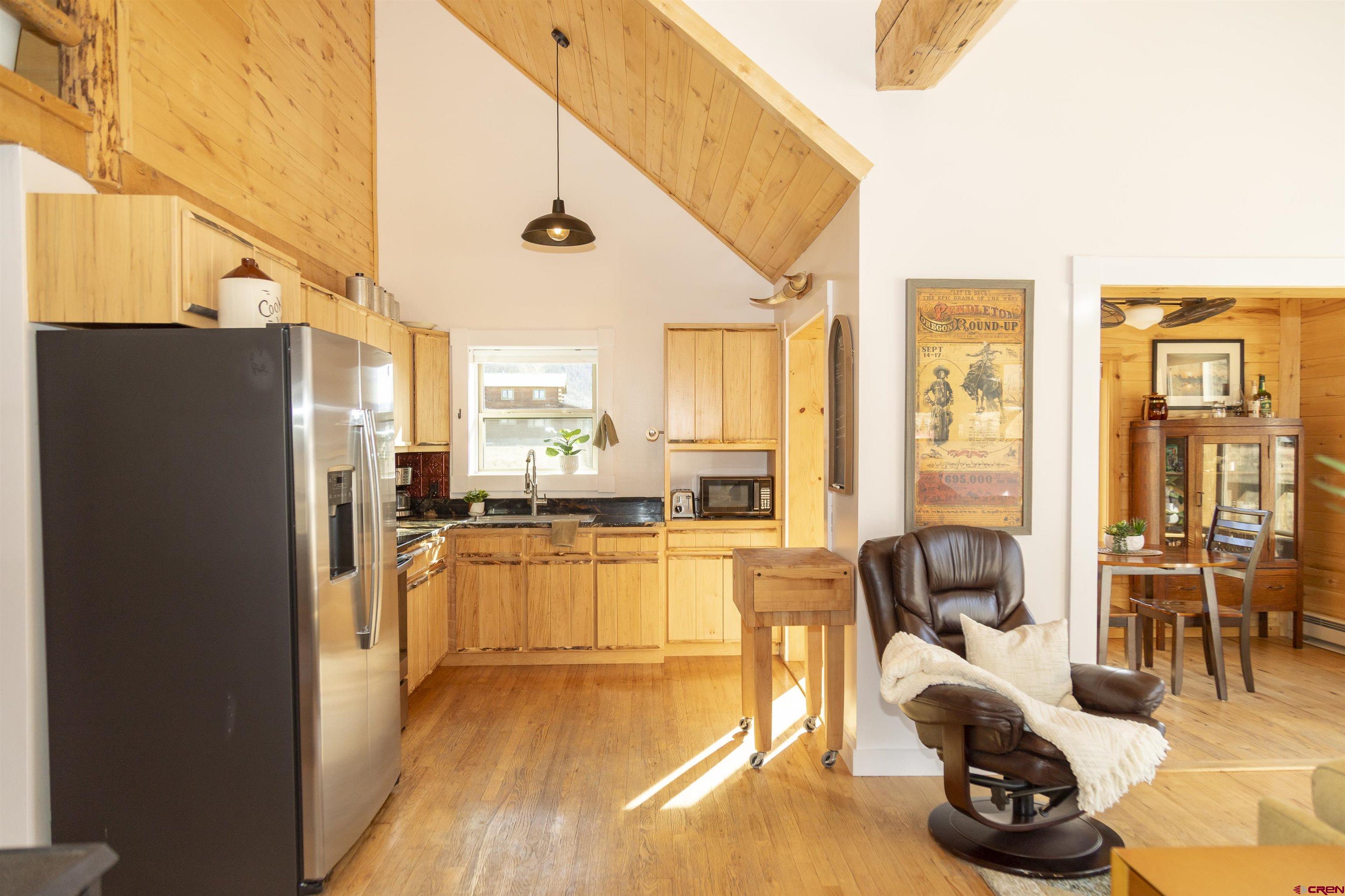 148 Rio Grande Drive Creede, CO 81130 - Photo 7 of 38 a view of a living room with furniture and floor to ceiling window