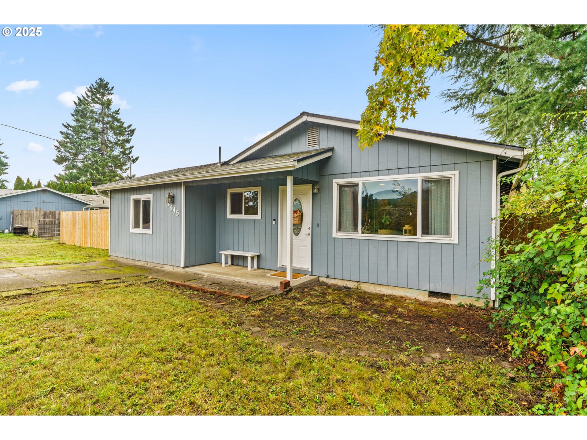2945 Hayden Bridge Road Springfield, OR 97477 - Photo 1 of 46 a front view of a house with a garden and yard