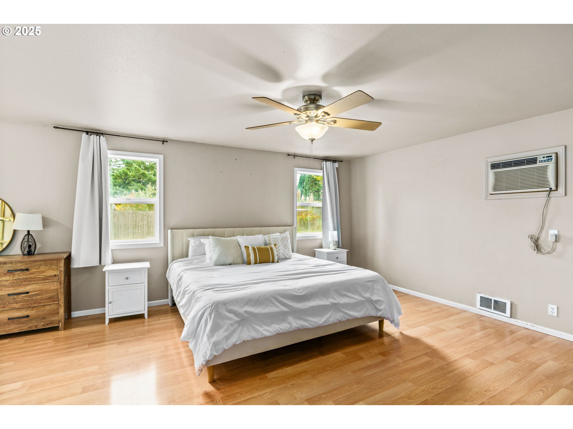 2945 Hayden Bridge Road Springfield, OR 97477 - Photo 11 of 46 a bedroom with a bed chandelier and a window