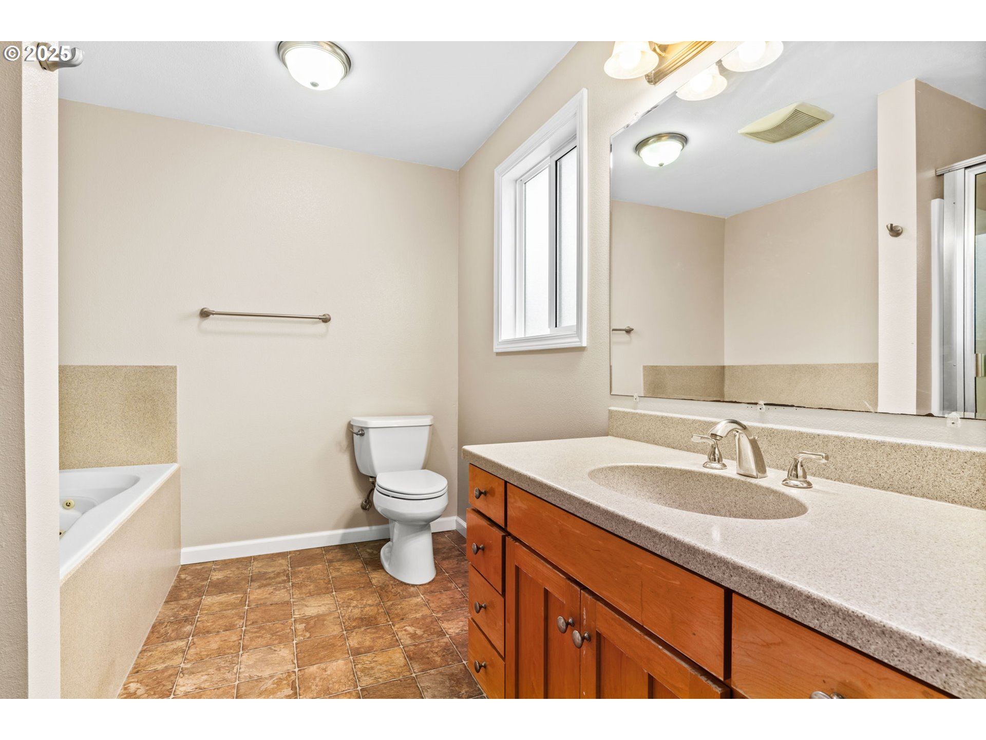 2945 Hayden Bridge Road Springfield, OR 97477 - Photo 17 of 46 a bathroom with a sink a toilet and bathtub