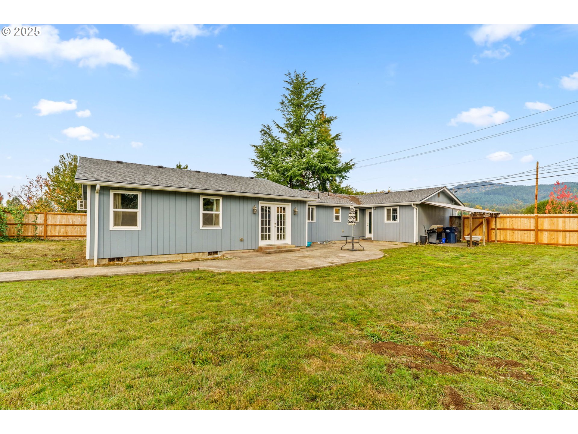 2945 Hayden Bridge Road Springfield, OR 97477 - Photo 24 of 46 a front view of a house with a garden