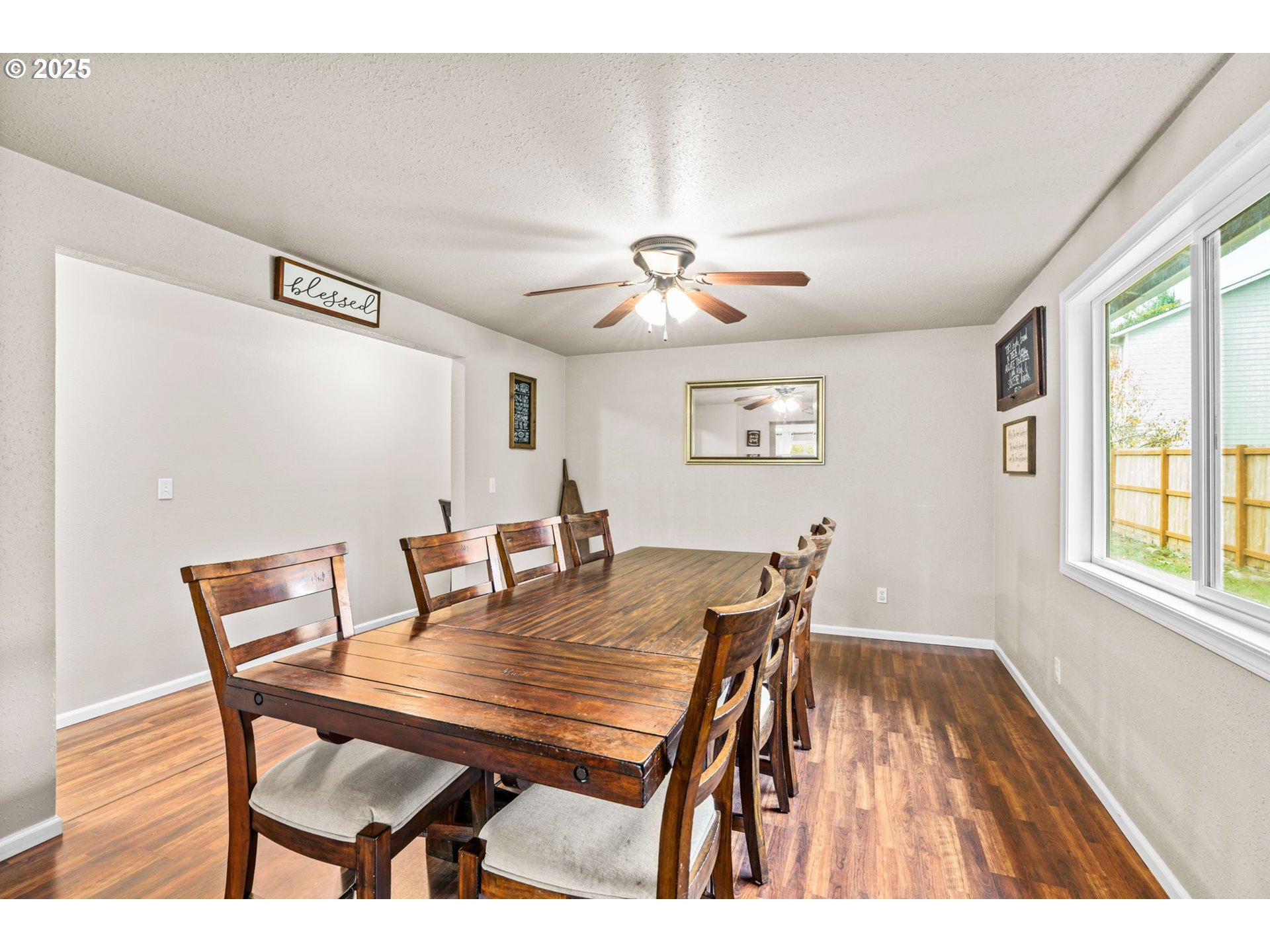 2945 Hayden Bridge Road Springfield, OR 97477 - Photo 10 of 46 a view of a dining room with furniture window and wooden floor