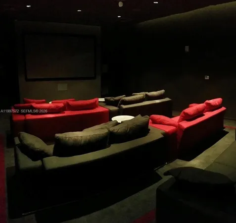 a living room with furniture and large windows