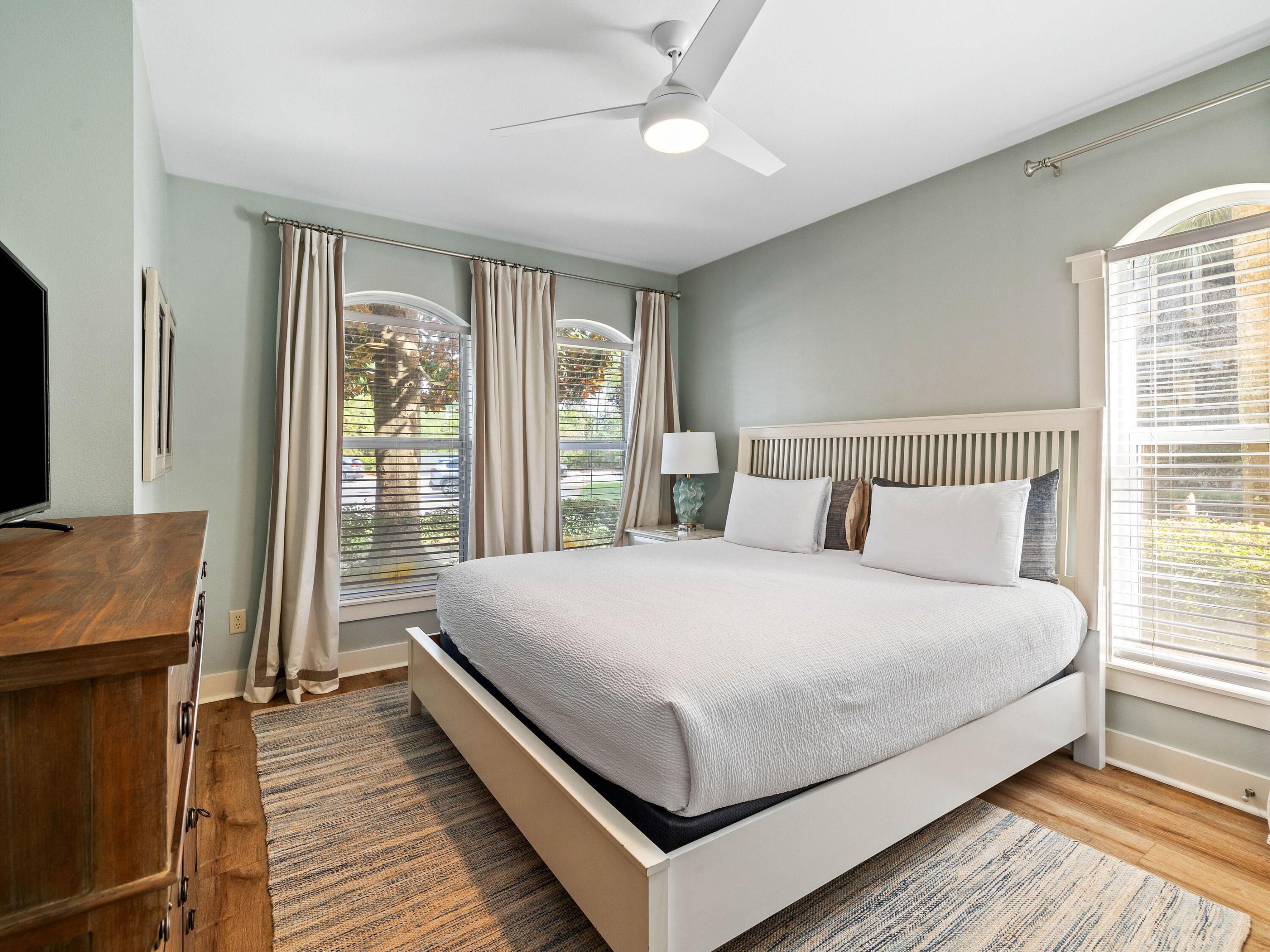 4545 East County Highway 30A, Unit C101 Santa Rosa Beach, FL 32459 - Photo 18 of 29 a large bedroom with a bed and wooden floor