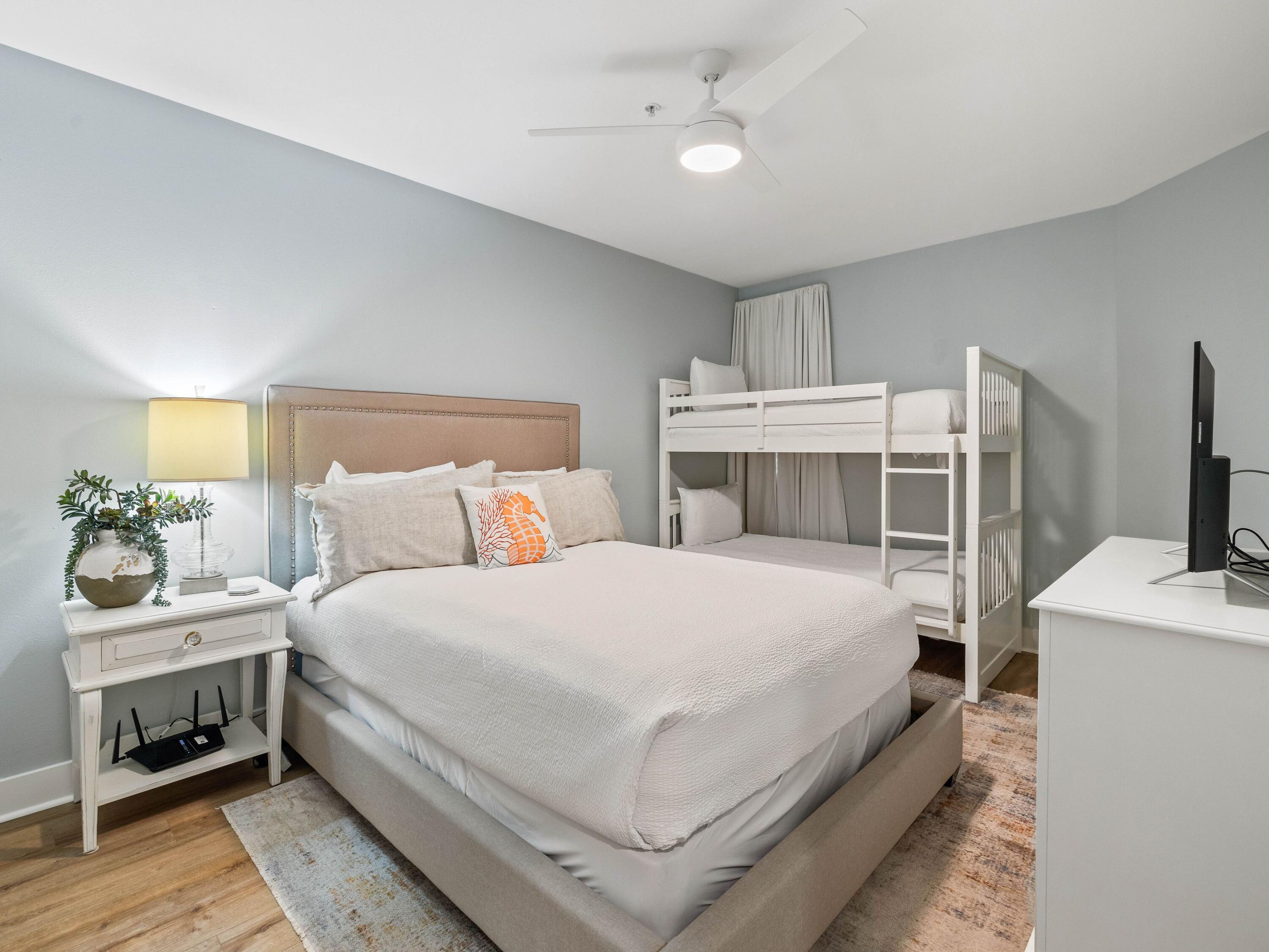 4545 East County Highway 30A, Unit C101 Santa Rosa Beach, FL 32459 - Photo 21 of 29 a bedroom with a bed and a flat tv screen on dresser