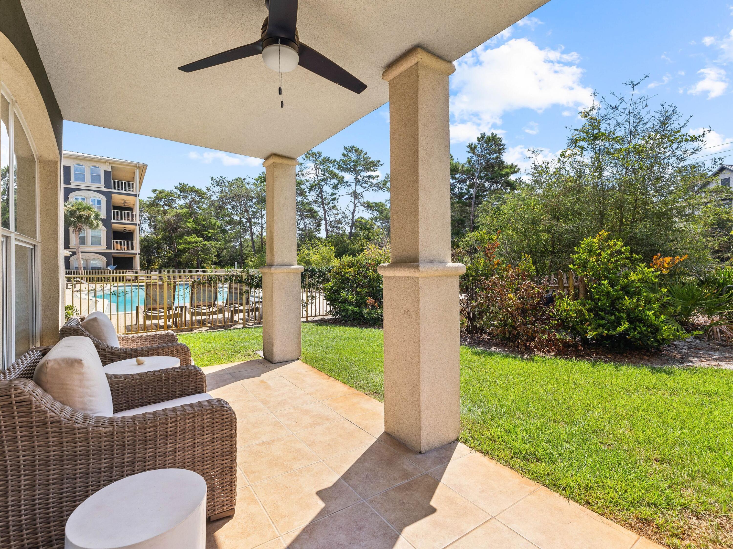4545 East County Highway 30A, Unit C101 Santa Rosa Beach, FL 32459 - Photo 23 of 29 a balcony with couple of chairs and a large window