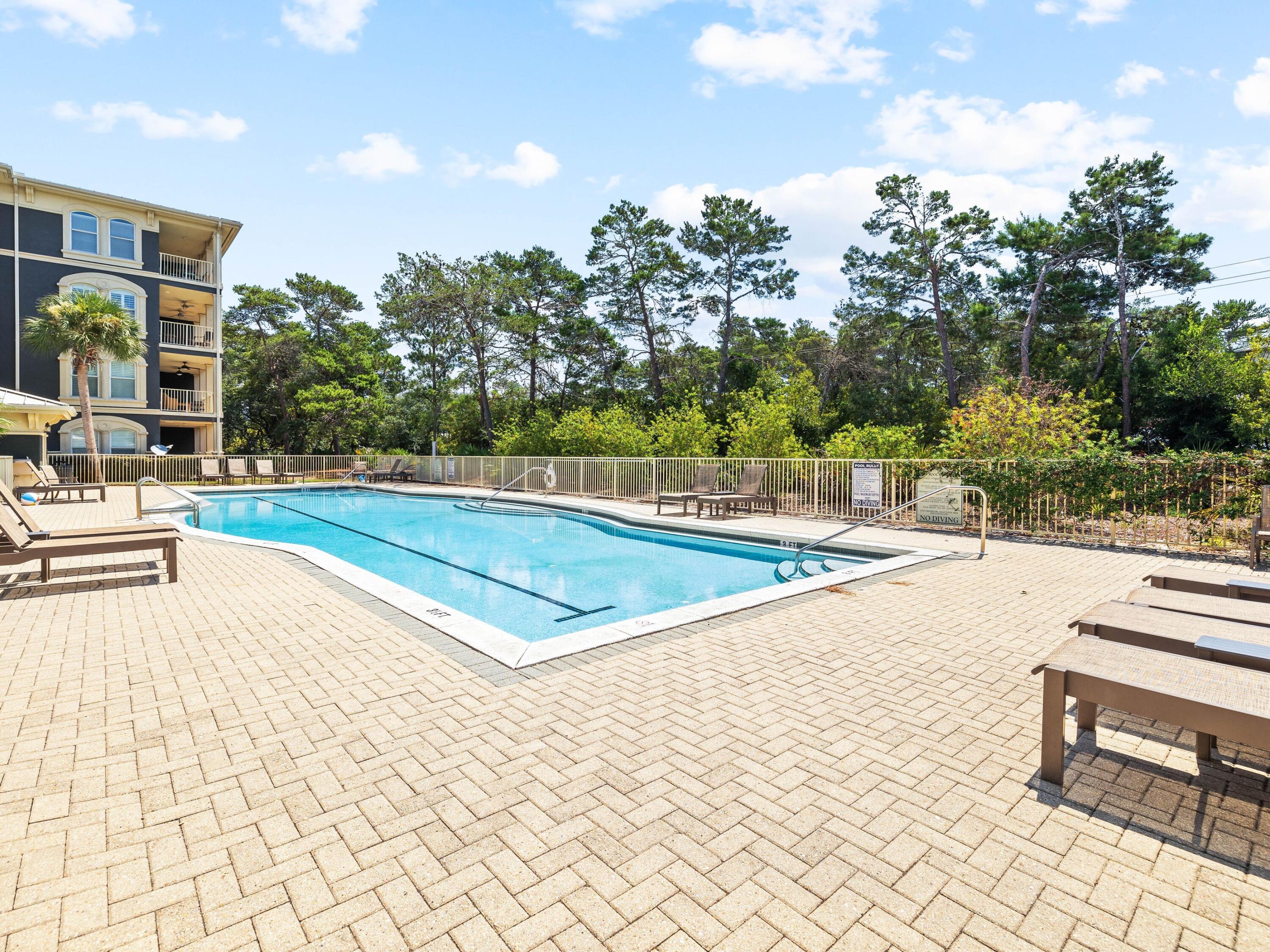 4545 East County Highway 30A, Unit C101 Santa Rosa Beach, FL 32459 - Photo 25 of 29 a view of a swimming pool and lounge chair