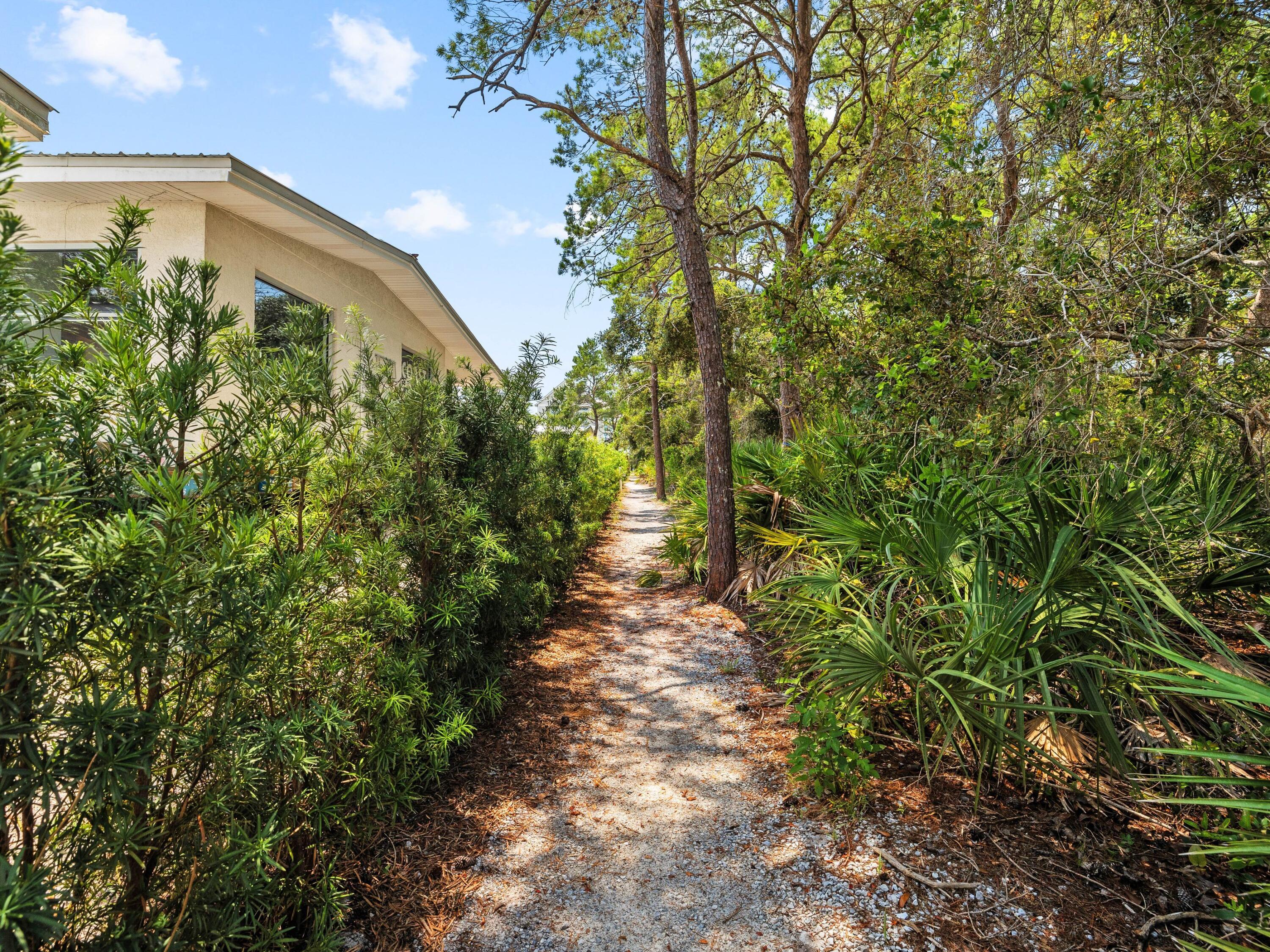 4545 East County Highway 30A, Unit C101 Santa Rosa Beach, FL 32459 - Photo 27 of 29 a front view of a house with a yard
