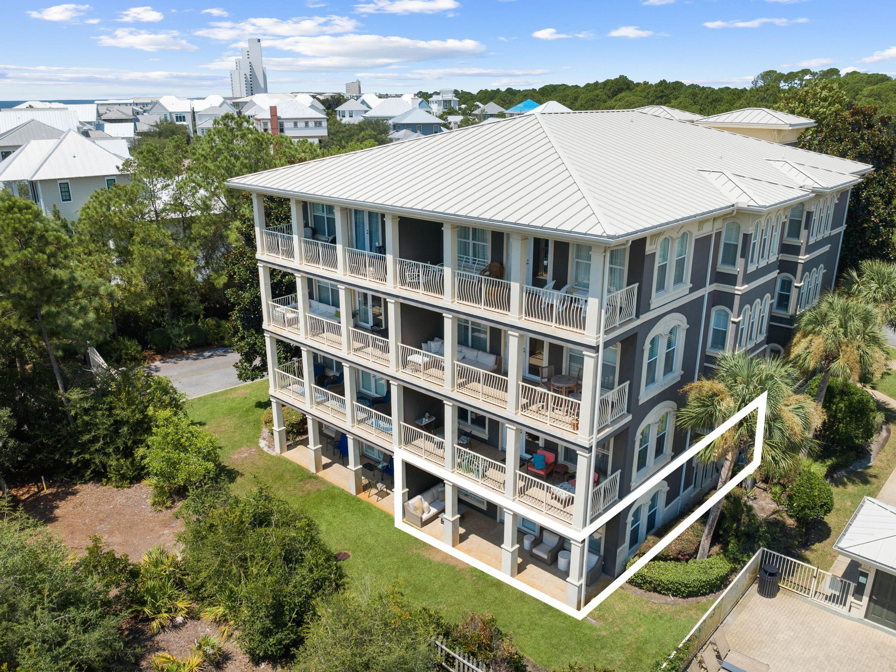 4545 East County Highway 30A, Unit C101 Santa Rosa Beach, FL 32459 - Photo 29 of 29 a aerial view of multi story residential apartment building with a yard and plants