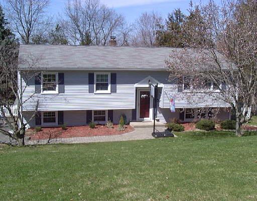 39 Quaker Ridge Road Bethel, CT 06801 - Photo 1 of 1 a view of a house with a yard and sitting area