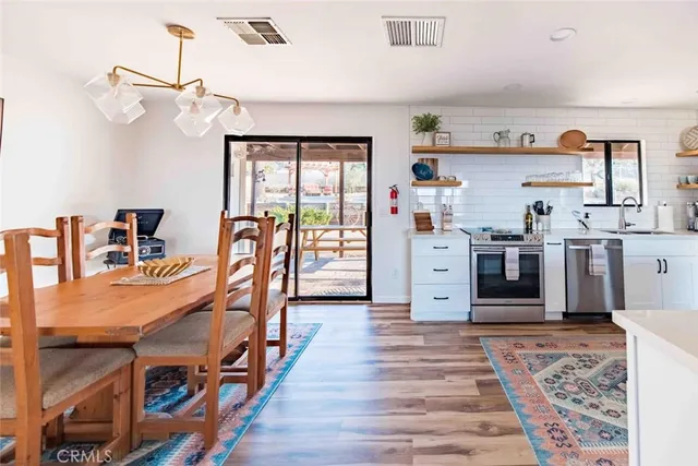 a very nice looking room with many windows and furniture