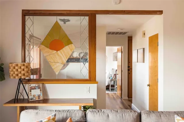 a view of a hallway with a dining room view