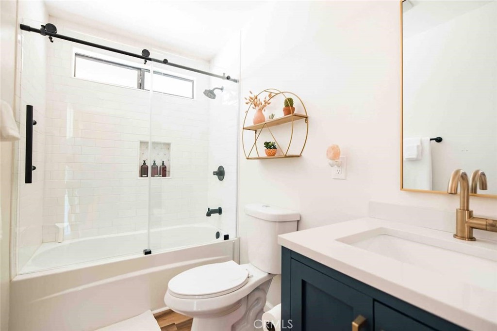 61029 Navajo Trail Joshua Tree, CA 92252 - Photo 22 of 41 a bathroom with a sink a toilet and a mirror