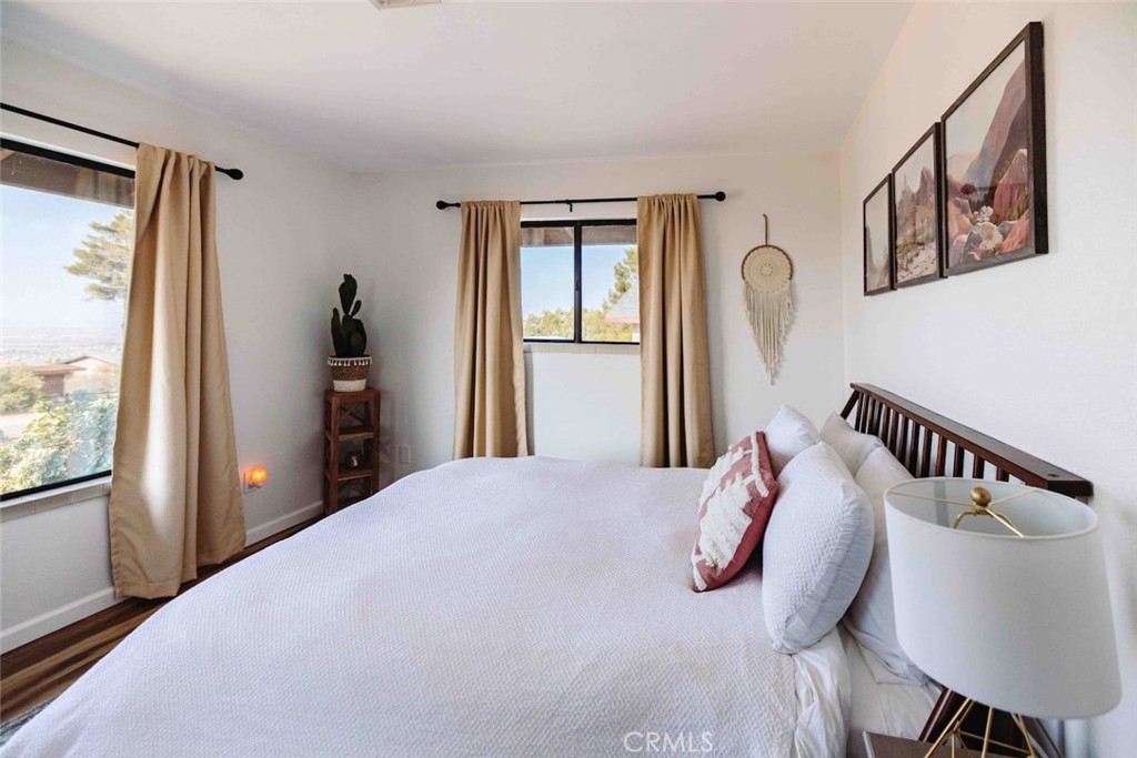 61029 Navajo Trail Joshua Tree, CA 92252 - Photo 23 of 41 a bedroom with bed and a window