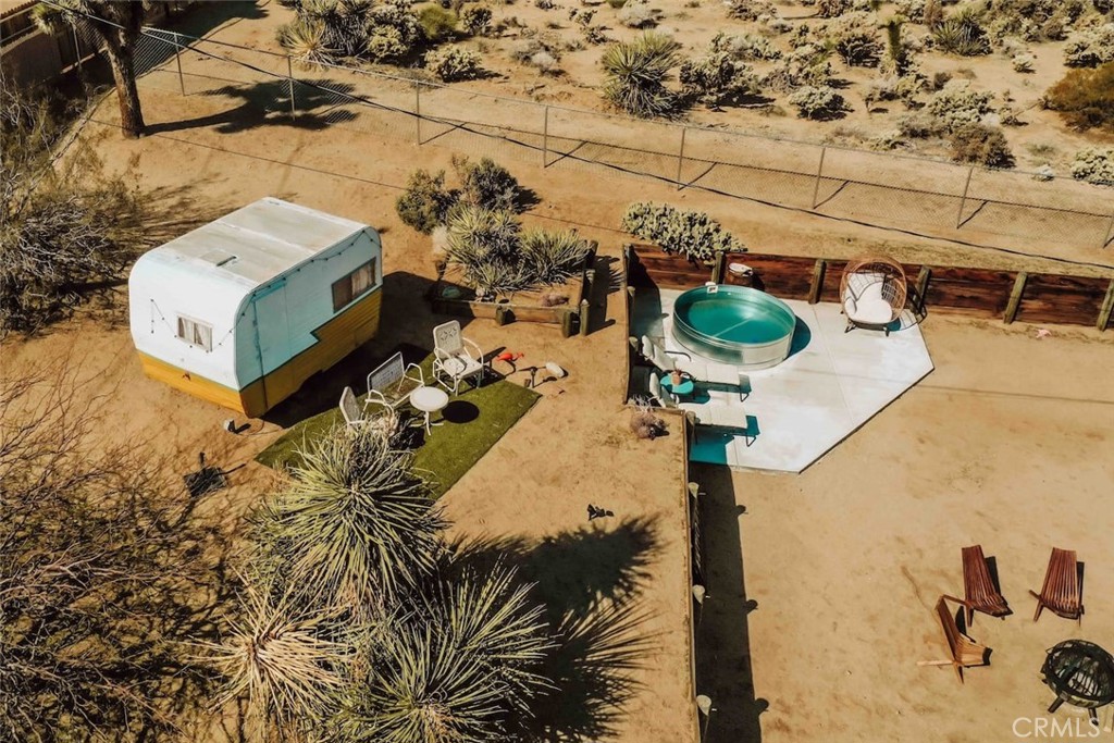 61029 Navajo Trail Joshua Tree, CA 92252 - Photo 32 of 41 a vase of flowers sitting on a table