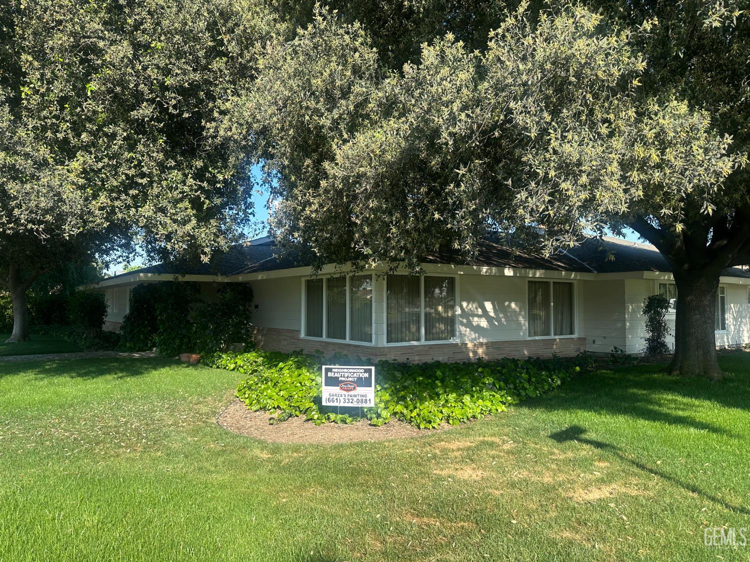 Undisclosed Address Wasco, CA 93280 - Photo 3 of 11 a front view of a house with a yard